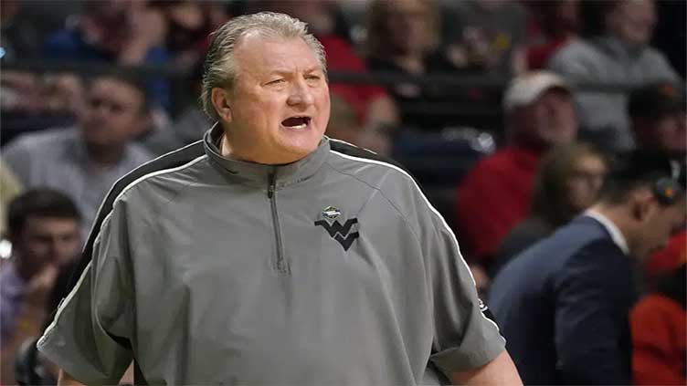 West Virginia's Huggins agrees to $1M pay cut, 3-game suspension for homophobic slur