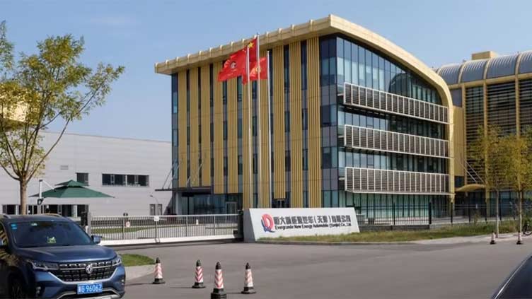 Shareholders of Evergrande's EV unit agree on restructuring deal