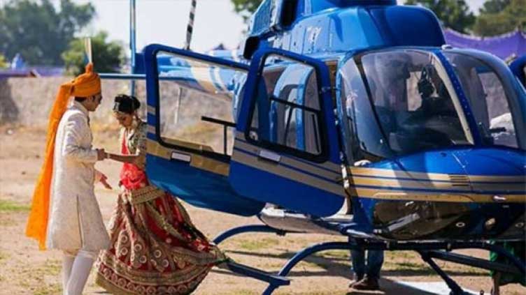 Groom lands in helicopter for wedding event  