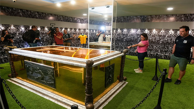 Pele's gilded, turf-lined tomb opens to public in Brazil