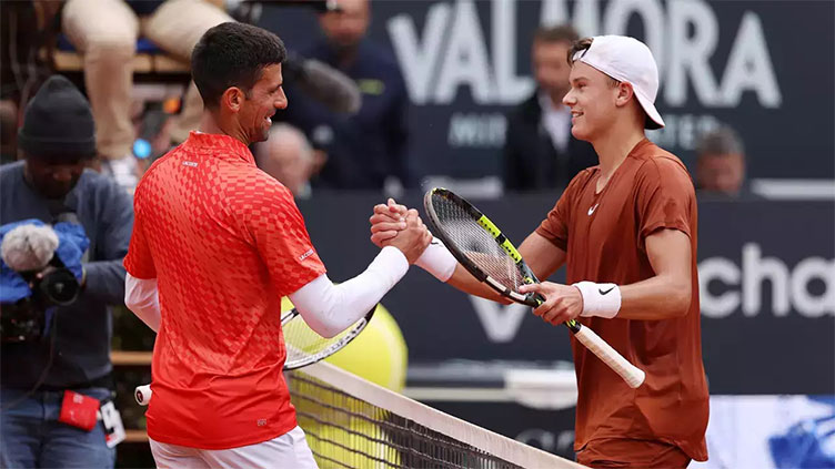 Rune upsets Djokovic to storm into Rome semi-finals, injured Swiatek retires