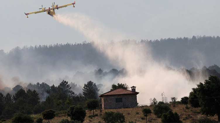 Villagers evacuated as wildfire ravages woodlands in western Spain