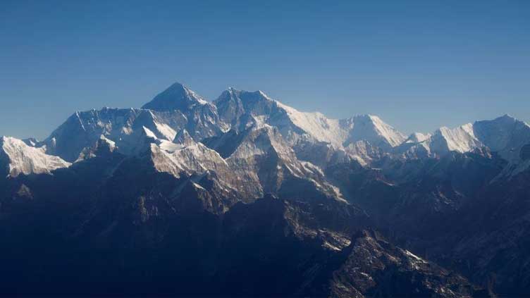 US mountaineer climbs rare Everest 'triple crown' as death toll reaches 12