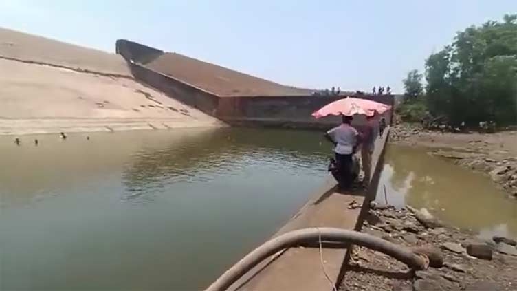 Indian official suspended after he drains reservoir to retrieve phone he dropped while taking selfie