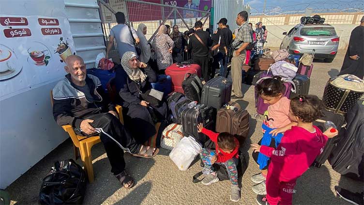 First evacuees leave Gaza as Israeli offensive intensifies