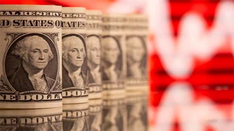 Dollar slips as traders see US rates peaking