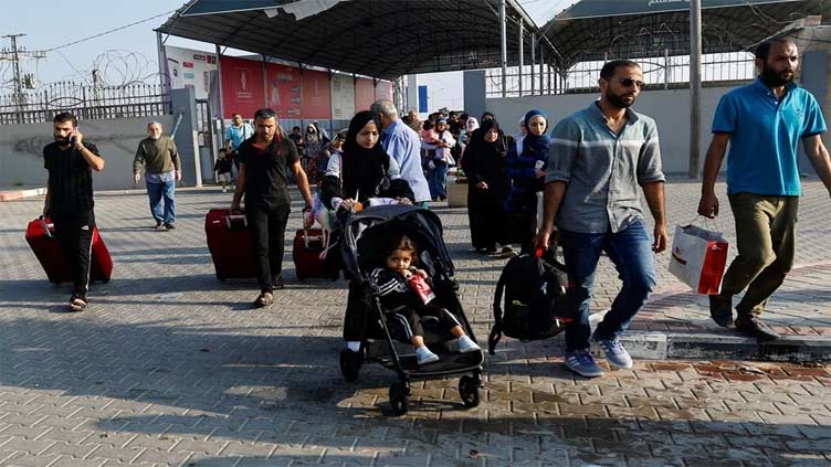 Gaza evacuees crossing into Egypt fear for those left behind