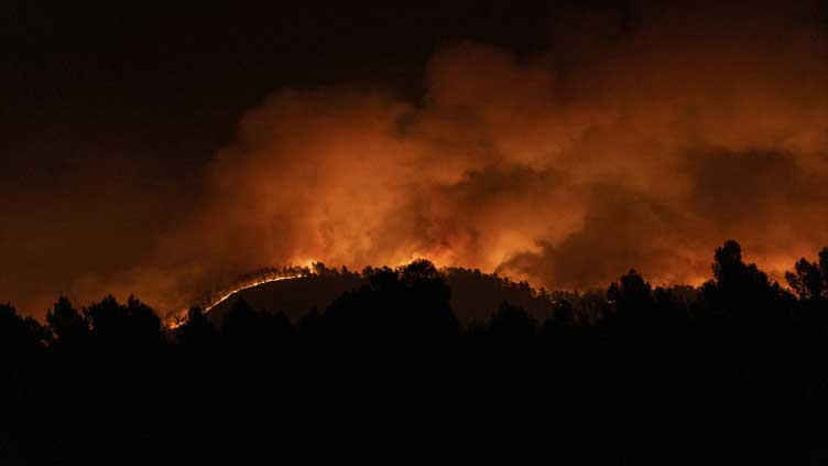 Hundreds evacuated as strong winds fan wildfire in eastern Spain