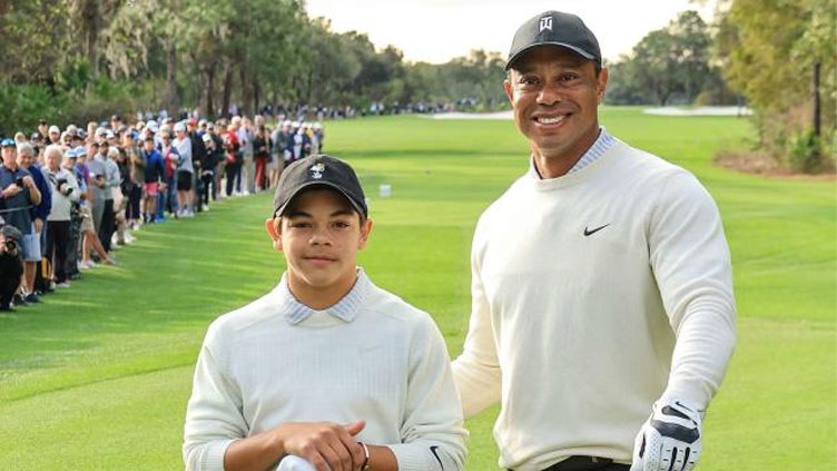 Tiger Woods appears fit for return after caddie role for son