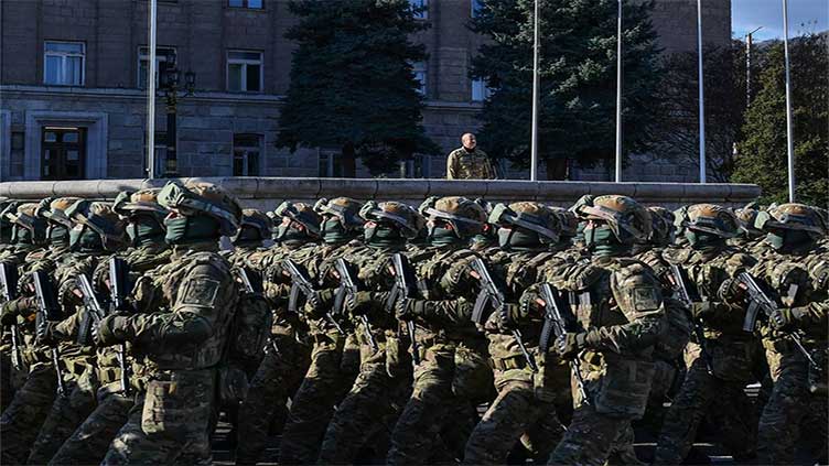 Azerbaijan's president addresses a military parade in Karabakh and says 'we showed the whole world'