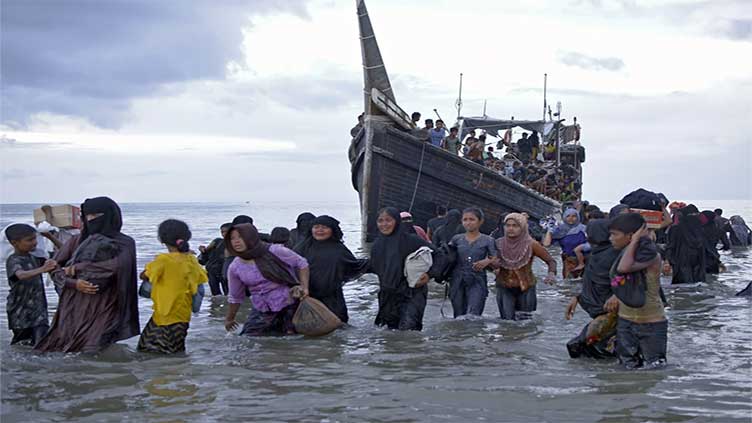 More than 240 Rohingya refugees afloat off Indonesia after they are twice refused by residents