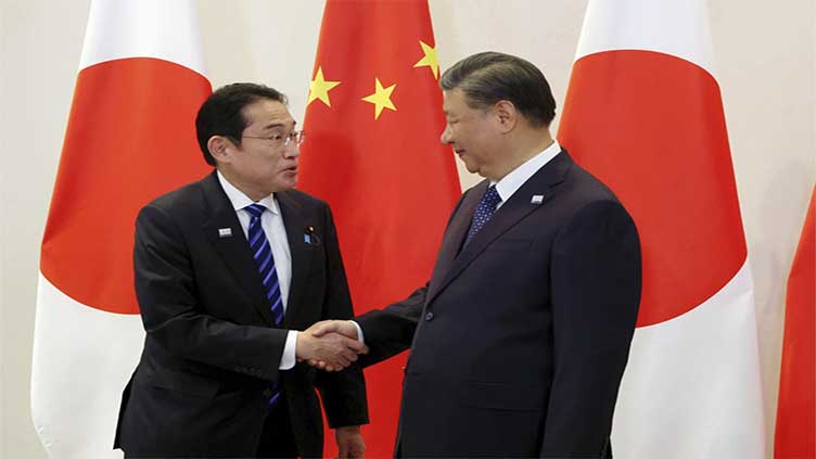 Japan and China agree to work on stable relationship, though only vague promises in seafood dispute