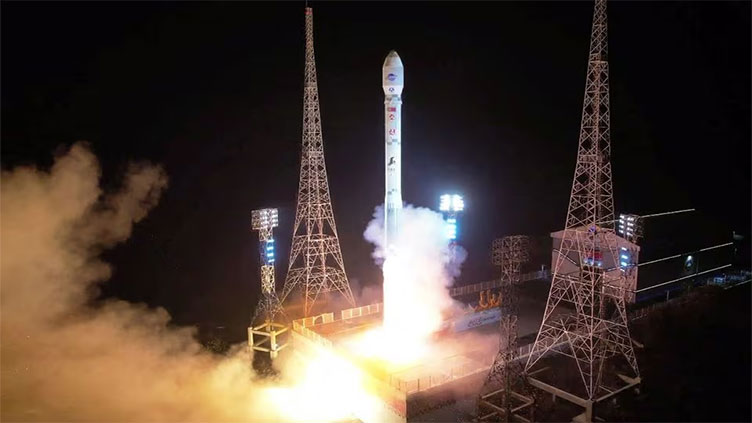 North Korea claims it launched first spy satellite, promises more