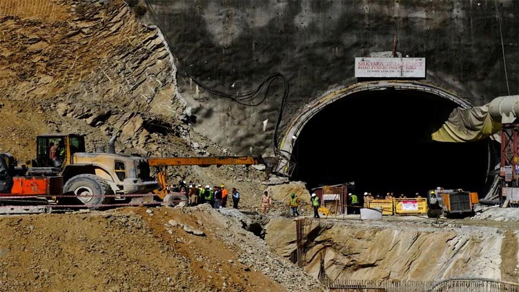 Indian rescuers drill halfway towards workers trapped in tunnel