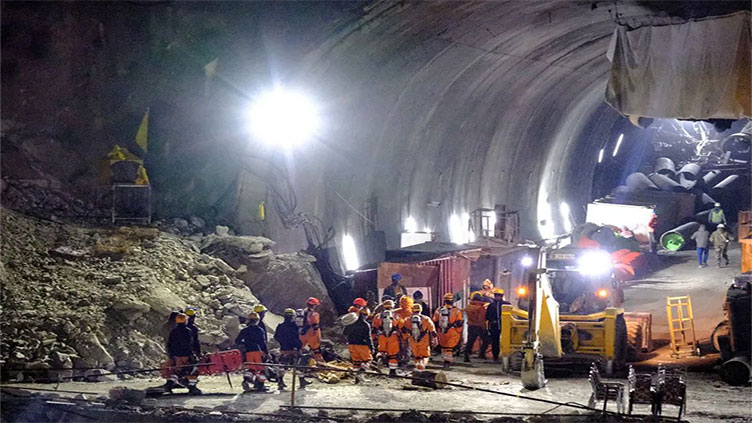 Indian rescuers close in on workers trapped in Himalayan tunnel
