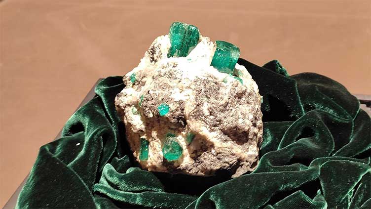 $1m green emerald with Quran verses engraved on display at Abu Dhabi Art fair