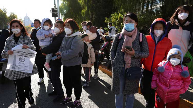 China grapples with respiratory illness spike; WHO says no unusual pathogen found