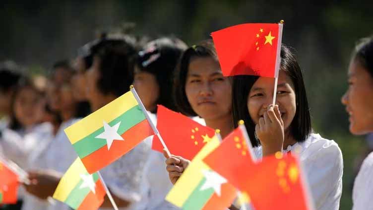 Myanmar convoy burns on China's border as its envoy meets for talks