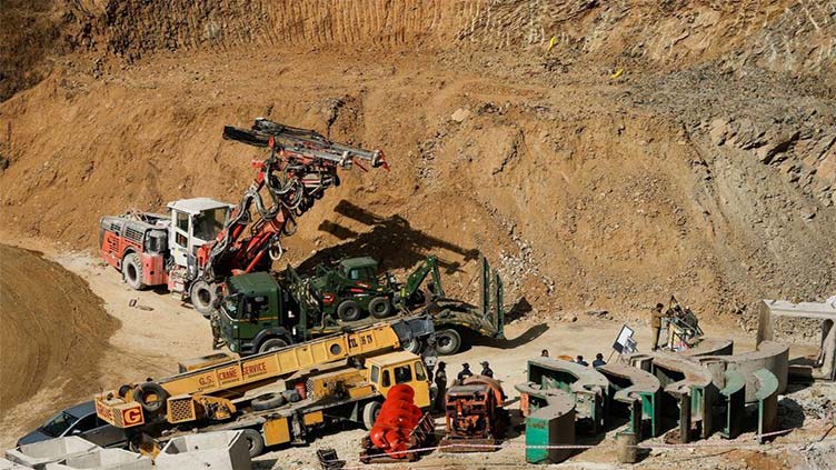 Indian rescuers, two weeks after tunnel collapse, try new tack to reach 41 workers