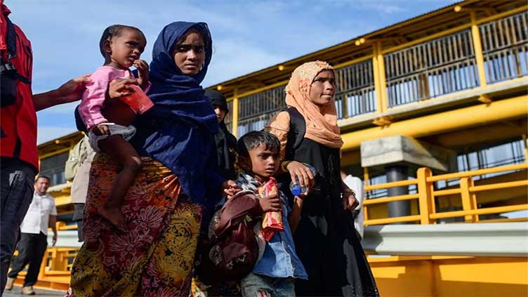 More Rohingya take children as they leave Bangladesh by boat - aid groups