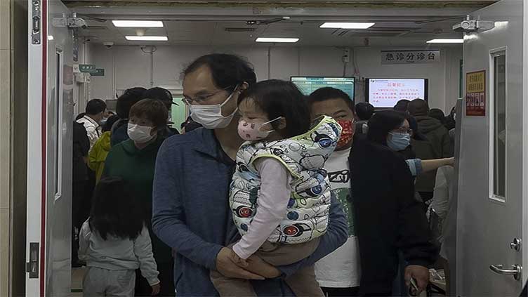 China says a surge in respiratory illnesses is caused by flu and other known pathogens