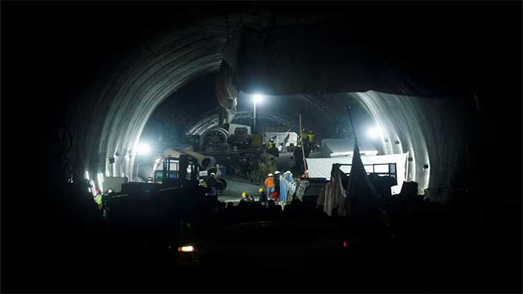 Indian rescuers start pulling out trapped workers from collapsed tunnel 