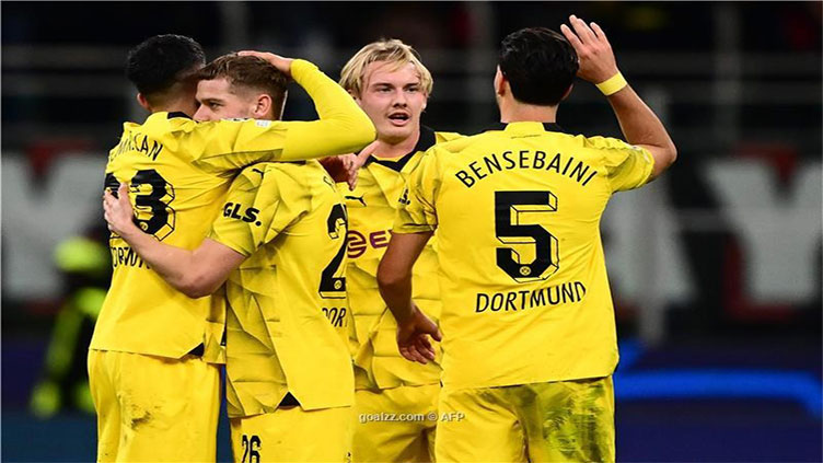 Dortmund see off Milan to reach Champions League knockouts