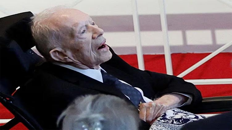 Former US president Jimmy Carter makes rare public appearance at wife's memorial