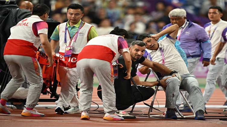 Athletics official in stable condition after being hit by hammer