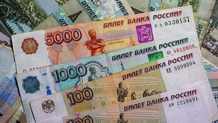 Russian rouble weakens past 100 to the dollar