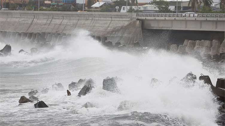 Flights cancelled, work suspended as typhoon Koinu grinds towards Taiwan