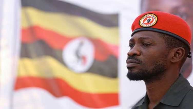 Uganda opposition leader forced into car at airport and driven home