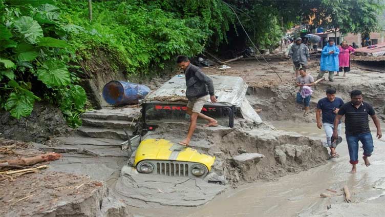 Indian rescuers struggle to reach flood-hit areas where over 100 are missing