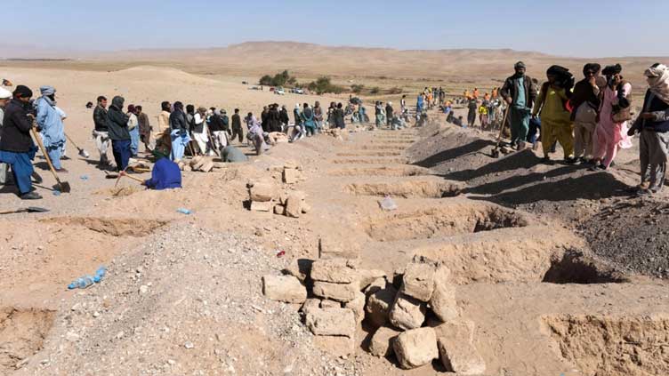 Volunteers dig for Afghan quake survivors as aid trickles in