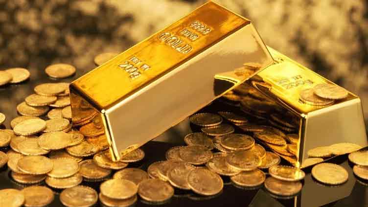 Gold edges up as it heads for best week since March