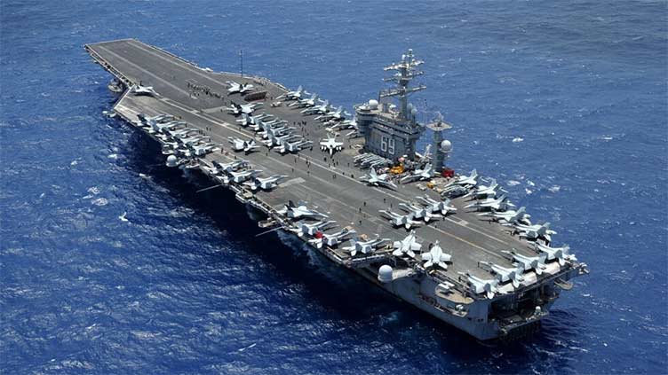 Second US aircraft carrier to back Israel as Biden stresses civilian protection