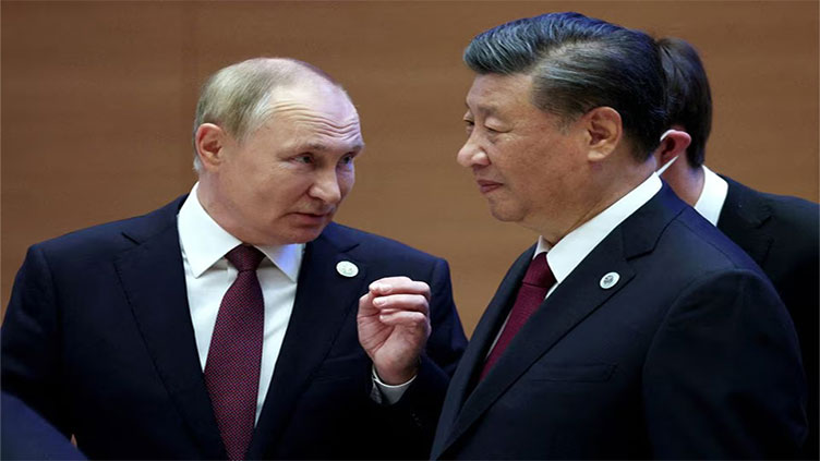 Putin visits 'dear friend' Xi in show of no-limits partnership