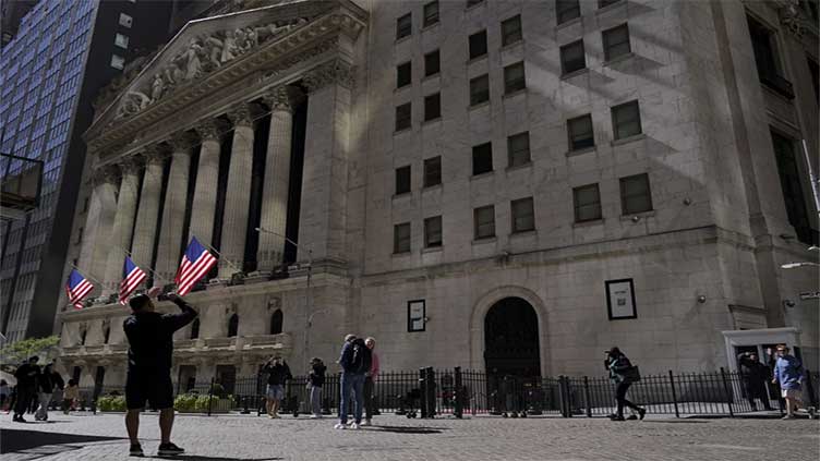 Wall St falls as investors assess more data, earnings; Fed meet in focus