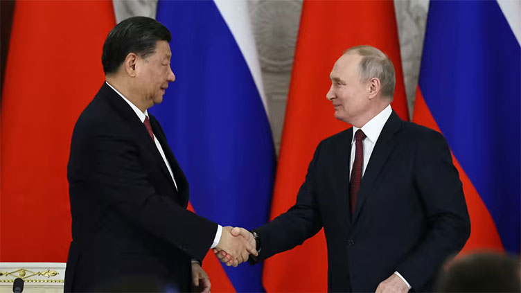 Russia's Putin says he will meet China's Xi soon