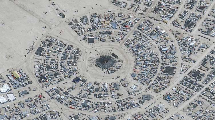 Rain in Nevada desert dampens Burning Man revelers' spirit