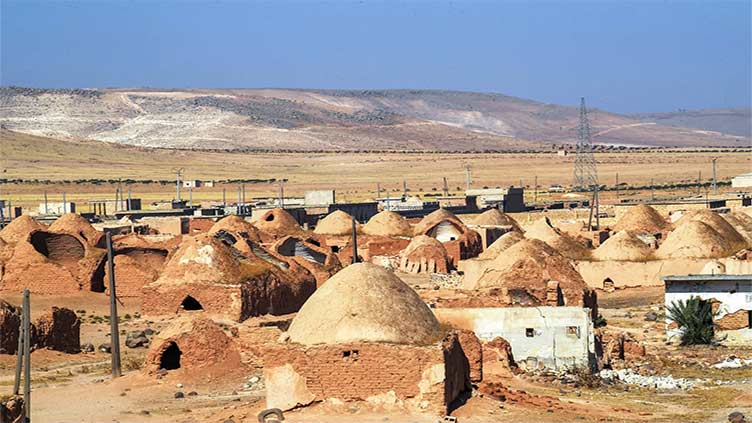 Syria's ancient adobe houses threatened by war, displacement