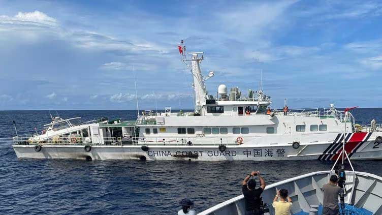 In cat and mouse game, Philippines resupplies troops in South China Sea atoll