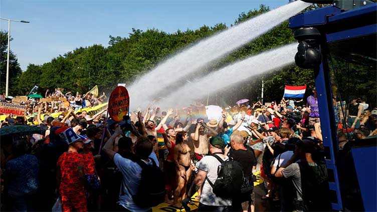 Netherlands police use water cannon, detain 2,400 climate activists