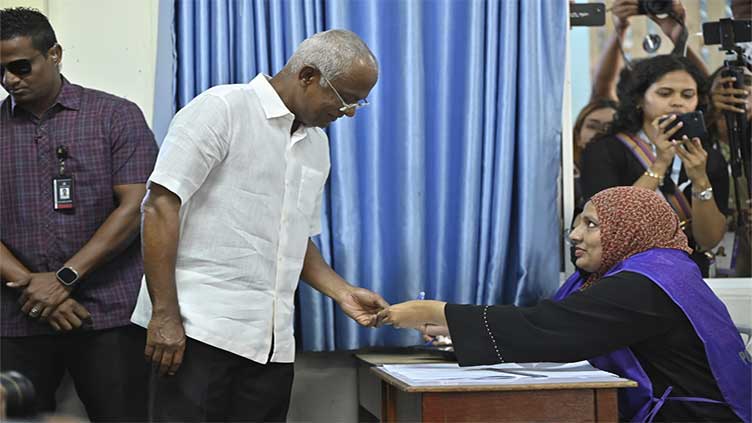 Maldives presidential runoff is set for Sept. 30 with pro-China opposition in a surprise lead