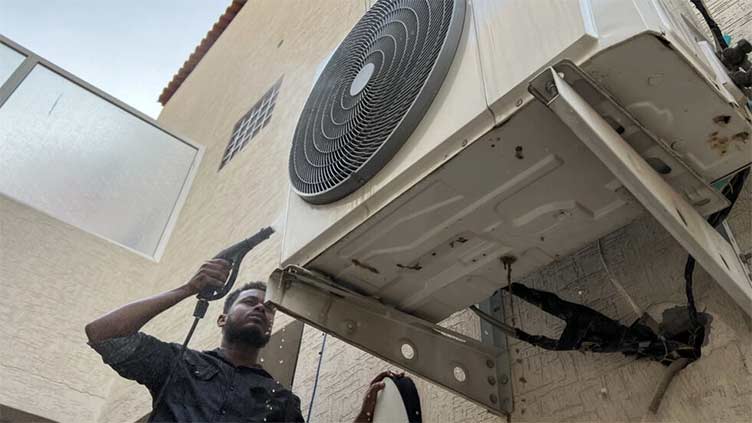 'No time to rest' for AC repairmen in sweltering Saudi