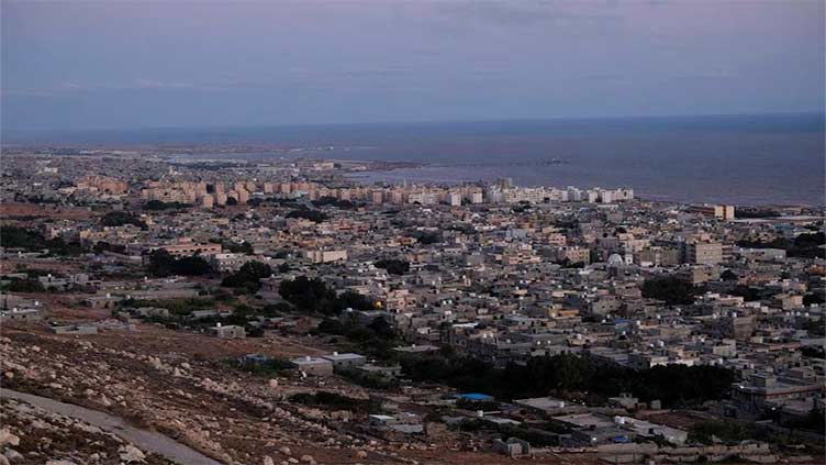 Libya flood survivors pick through ruins in search of missing as mayor fears toll could reach 20,000