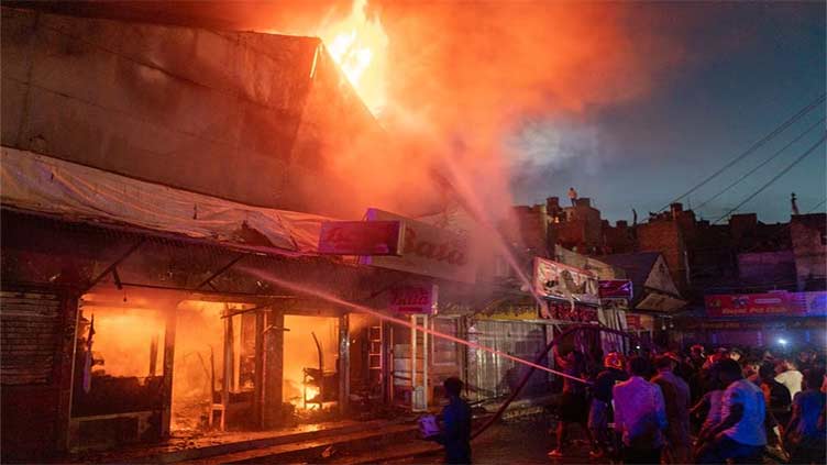 Hundreds of shops gutted in market fire in Bangladesh