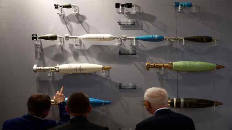 At London arms fair, global war fears are good for business