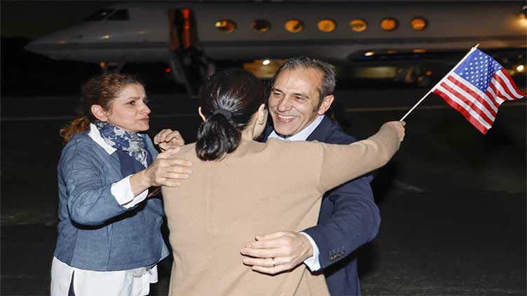 Americans released by Iran arrive home, tearfully embrace their loved ones and declare: 'Freedom!'