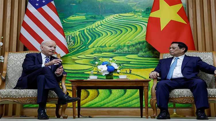 Days after Biden's visit, Vietnam detains energy expert